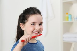 child brushing teeth