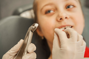 Preschool child just after a tooth extraction